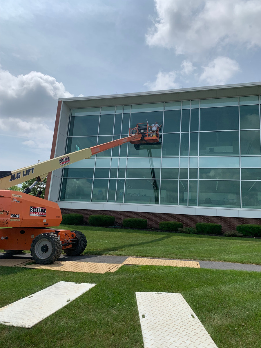 Crystal Clear crew cleaning a commercial glass building in Central Pennsylvania